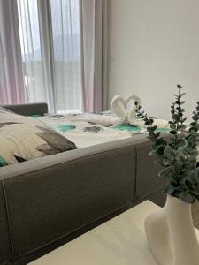 a bedroom with a bed with a vase with a plant at Private Villa with Pool - Utjeha Hills in Utjeha +41 photos
