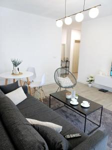 a living room with a couch and a table at Private Villa with Pool - Utjeha Hills in Utjeha