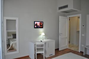 TV a/nebo společenská místnost v ubytování Lodges le Mura