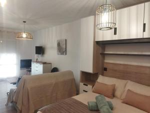 Postel nebo postele na pokoji v ubytování Loft Claudia Portil