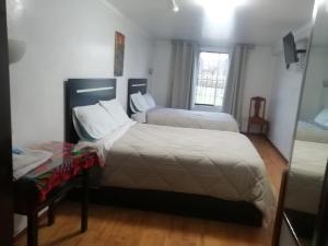 Katil atau katil-katil dalam bilik di Hostal Lucerito