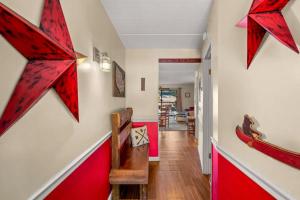 a hallway with red stars on the wall at Heart of Gatlinburg by Avada Properties in Gatlinburg