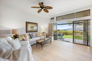 a living room with a couch and a ceiling fan at Kapalua Ridge Villa 2712 in Kapalua +24 photos