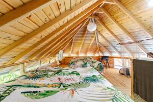 a bedroom with a large bed in a attic at Cabarete Boutique Kite Hotel for up to 15 people in Cabarete +83 photos