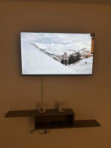 Televisyen dan/atau pusat hiburan di Moderno Apartamento Central