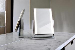 a mirror sitting on a counter in a bathroom at Kempinski Central Avenue Dubai in Dubai