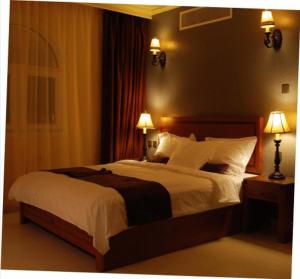 Ένα ή περισσότερα κρεβάτια σε δωμάτιο στο La Rosa Hotel By Brother International