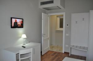 TV a/nebo společenská místnost v ubytování Lodges le Mura