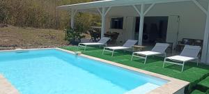 Bazén v ubytování Villa Kazadan - Piscine Privée - 5 min de la plage Cap Macré nebo v jeho okolí
