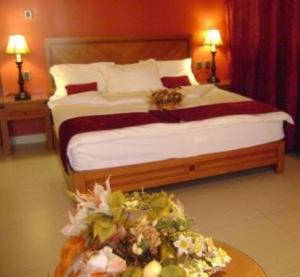 Ένα ή περισσότερα κρεβάτια σε δωμάτιο στο La Rosa Hotel By Brother International