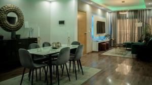 a dining room with a table and chairs at Prainha Beach Apartments - Walk to Prainha Beach - AC - Fast WiFi - Easy Check-in in Praia