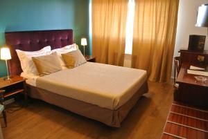 Postel nebo postele na pokoji v ubytování Hôtel Albion