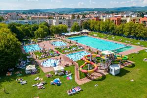 an aerial view of a water park with a pool at Studio Fortuna Park Residence in Sfântu-Gheorghe