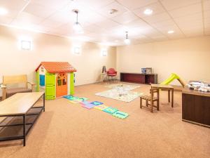 a classroom with a play room with a play house at Chalet with shuttle bus in Gresse in Gresse-en-Vercors