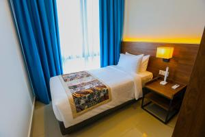 Signata Genting Highlands客房内的一张或多张床位