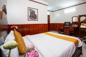 Postel nebo postele na pokoji v ubytování Okay One Hotel