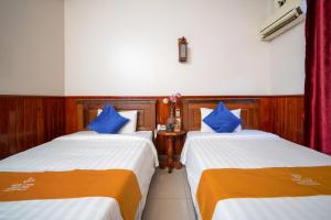 Postel nebo postele na pokoji v ubytování Okay One Hotel