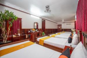 Postel nebo postele na pokoji v ubytování Okay One Hotel