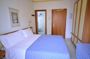 Postel nebo postele na pokoji v ubytování Hotel Man