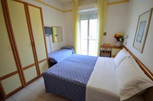 Postel nebo postele na pokoji v ubytování Hotel Man