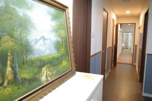 a large painting on a wall in a hallway at M2-3Haneda Lex House 9BDR Max22 people 2WC 2Bath 1min from Sta FreeParking 'Private use in Tokyo