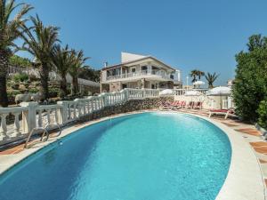 a swimming pool in front of a house at Luxury Villa with Jacuzzi in Les Issambres in Les Issambres
