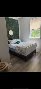 a bedroom with a bed and a window at Full House or Rooms & private bath Stays- Diamond Street Beautiful Luxury Estates in Philadelphia