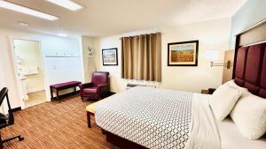 Postel nebo postele na pokoji v ubytování Morgan Inn and Suites Walla Walla