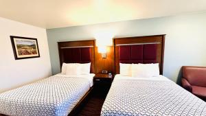 Postel nebo postele na pokoji v ubytování Morgan Inn and Suites Walla Walla