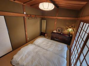 Postel nebo postele na pokoji v ubytování Samurai Manner -Tea House
