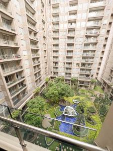 a view from the balcony of a large apartment building at Oslandmark Residence in Bandung
