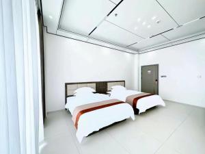 Postel nebo postele na pokoji v ubytování Meizhou Island Zhengxinju Homestay