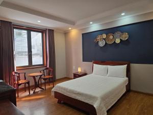 Postel nebo postele na pokoji v ubytování CAMY Hotel Vung Tau