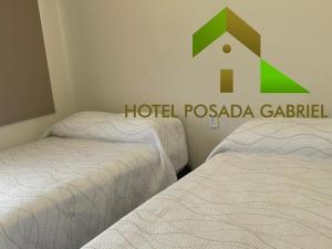 Postel nebo postele na pokoji v ubytování Hotel Posada Gabriel