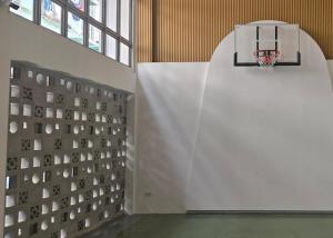 an empty gym with a basketball hoop on the wall at BEAT Warii Hostel at Chaophraya River in Bangkok +56 photos