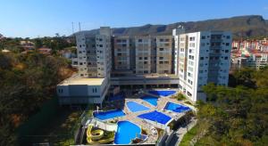 an overhead view of a building with swimming pools at PARK VEREDAS - Apto 415 - Vista para Piscina in Rio Quente