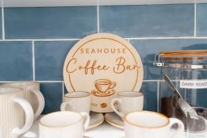 a sign for a coffee bar on a counter with cups at West Palm Beach Elegant 5BR with Hot Tub and Fire Pit Near Beach in West Palm Beach
