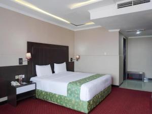 Кровать или кровати в номере Grand Antares Hotel +142 фотографии
