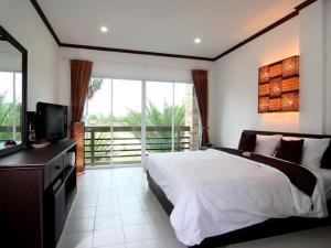 En eller flere senge i et værelse på Sritrakul Place + 55 billeder