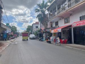 a street with a truck driving down the street at Zeus Hotel in Siem Reap +3 photos