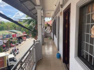 a balcony of a building with a view of a street at Zeus Hotel in Siem Reap