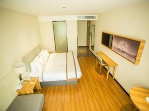 Ένα ή περισσότερα κρεβάτια σε δωμάτιο στο JTOUR Inn Hechi Yizhou Municipal Central Plaza +193 φωτογραφίες