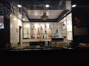 a bar with a lot of bottles of alcohol at Hotel mansurya in Jamshedpur