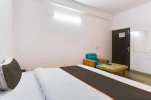 Postel nebo postele na pokoji v ubytování Hotel O Happy Residency