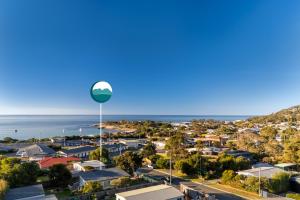 a view of a suburb with a water tower at Sweet Az in Bicheno