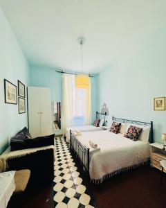 A bed or beds in a room at Affittacamere Firenze in Libertà Parterre