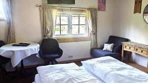 A bed or beds in a room at Schuberts Oderbruch Landpension