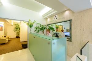 Televízia a/alebo spoločenská miestnosť v ubytovaní Adriatic Deluxe Apartments