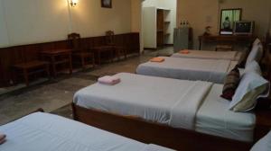 a room with four beds in a room at Champa Residence Hotel in Pakse +38 photos
