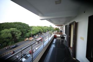 a view of a highway from the balcony of a building at Hotel Park Gardenia in Nagpur